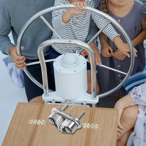 Stainless steel cam cleat with dual jaws, mirror-polished marine deck hardware on a wooden surface