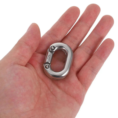 Close-up of an 8mm marine-grade 316 stainless steel quick-link chain connector held in hand