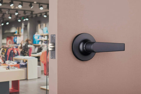 Brinks Commercial 4 Pack Light Duty Keyed Door Entry Storeroom Lever Matte Black installed on commercial door