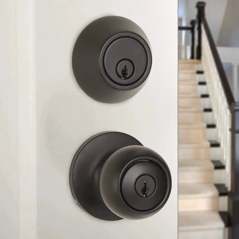 Secure exterior door entry with a durable knob and deadbolt, keyed alike for easy access, coastal matte black finish, installed on door