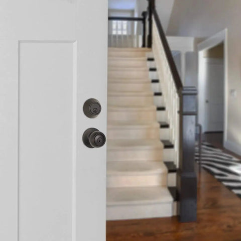 Secure exterior door entry with a durable knob and deadbolt, keyed alike for easy access, coastal matte black finish, installed on door