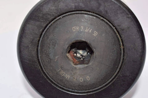 Close-up of a Mcgill cfh 2 3/4 sb – flat cam follower – heavy stud type showing center details and text marking