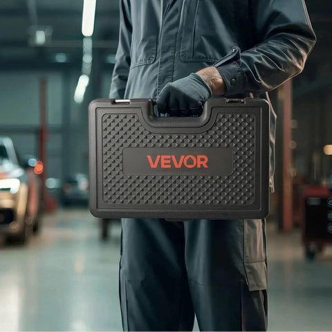 Mechanic holding a carrying case containing a 36 Piece Pull And Press Sleeve Kit With Carrying Case For Removing And Installing Bushings Bearings And Seals Compatible With Cars LCVs And HGV Engines Durable Steel Spindles For Professional Workshop Use