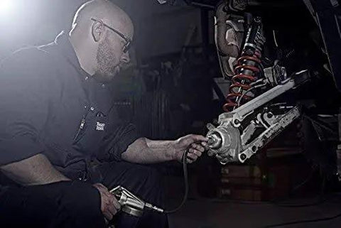 Person using 40mm Wheel Bearing Greaser Kit For Polaris ATVs UTVs And SxS Must Have Quick Grease Packer For Bearings Without Removing The Axle Or Suspension No Fuss Maintenance And Long Lasting Performance Tiger Tool on vehicle suspension.