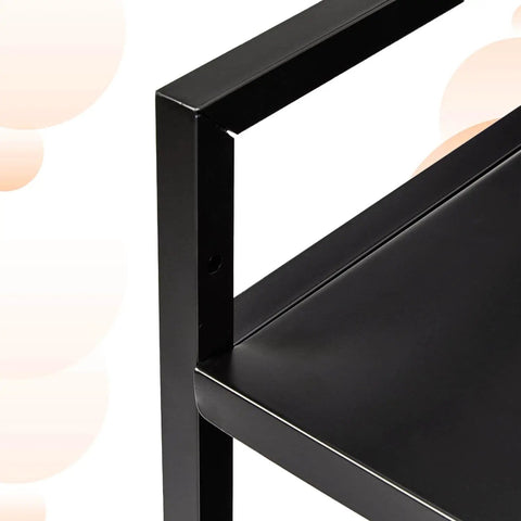 Close-up of black metal corner and shelf of Three Tier Metal Rolling Utility Cart With Open Shelves For Quick Access And Grab And Go Mobility Ideal For Kitchen Bathroom And Workshop Durable Metal Construction In Black From Amazon Basics.