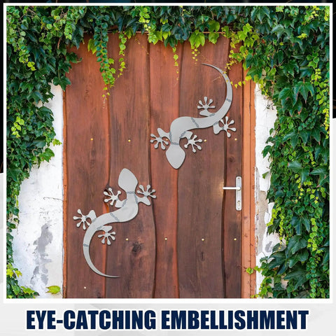 Metal gecko sculptures on wooden door with greenery, related to Beginner Friendly Gecko Welding Kit For Tig Mig Arc Gas Practice.