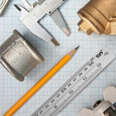 Stainless Steel Ruler Metal Straight Edge 6 Inch Ruler Set 12 Pack Durable Non Bendable Rust Resistant next to tools on grid paper