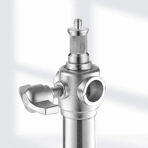 Close-up of Three Piece Knurled One Quarter To Three Eighths Inch Metal Male Converter Screw Adapter Spigot Set on light stand