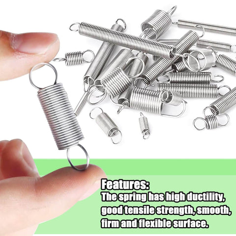 Close-up view of a person holding a metal spring coil with more springs scattered in the background, featuring high ductility and tensile strength.