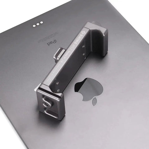 Full Metal Tablet Tripod Holder With Universal Clamp And Arca Swiss Dovetail Mounts on an iPad, showing secure fit.