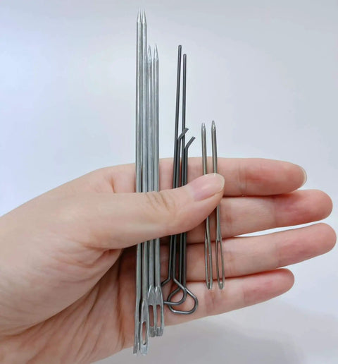 Hand holding candle making tools from All In One Candle Making Kit For DIY Fans With Punching Needle Wick Insertion Tools by Phinicco
