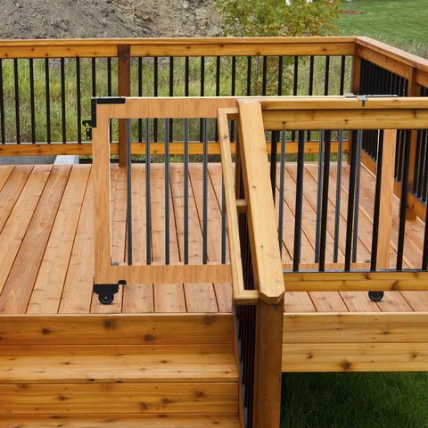Wooden deck with wooden and black metal railing, showing a gate for smooth access, use with Heavy Duty Sliding Gate Kit Black Hardware Set.