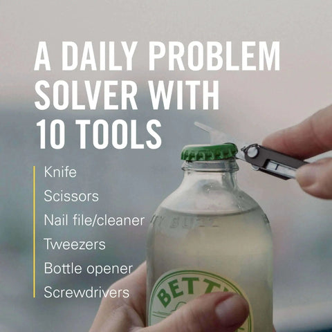 Leatherman Micra Keychain Multi Tool With Scissors And Knife opening a bottle, showcasing its compact stainless steel design.