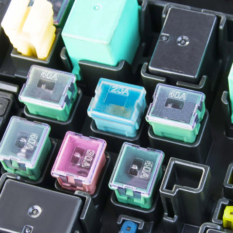 Close-up of a Low Profile Automotive Fuse Kit For Cars Trucks And Suvs 10 Pack Box Shaped Micro Cartridge Fuses, various colors