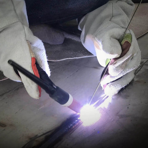 Welder using Mild Steel ER70S-6 Copper Coated Shielded Gas MIG Welding Rod for structural fabrication