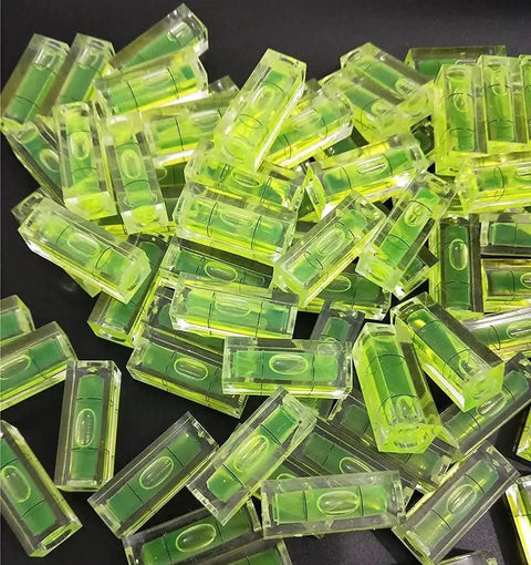 Pile of Six Piece Mini Bubble Level Set For Alignment And Picture Hanging In DIY Craft Projects Acrylic 10x10x29mm Yellow Green With Black Lines