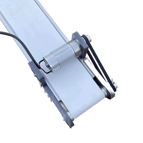 Close-up of Mini Production Line Conveyor System 10x50cm DIY Electric Elevator Model Friction Experiment Device on desktop