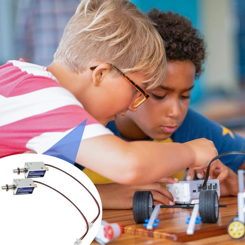 Two TEHAUX 12V mini push-pull solenoids, open-frame with wires, shown with an educational robotics kit