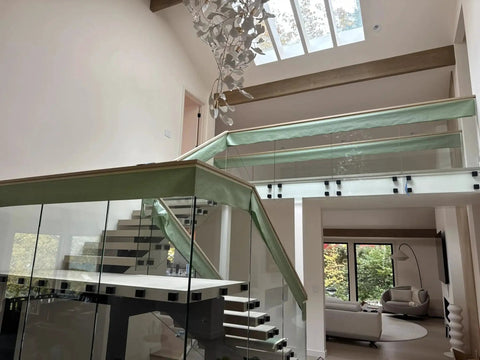 Indoor balcony with glass railings using Heavy Duty Satin Stainless Steel Glass Clamp Standoffs Inline Design 2 Inch For 3/8 1/2 9/16 Inch Glass Thickness Pack Of 2 Marine Grade AISI 316 Stainless Steel For Indoor Outdoor Use On Balconies Decks And Stairs Railings.