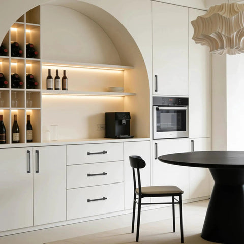 Modern kitchen with 10 Pack 5 Inch Gray Kitchen Cabinet Handles on white cabinets and black table