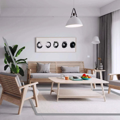 Modern living room with wooden furniture and artistic decor, featuring a cozy seating area and abstract art on the wall.
