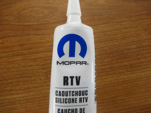 Tube of Mopar RTV Caoutchouc Silicone Sealer for transmissions, featuring branding and nozzle for application