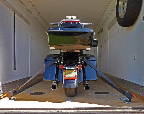 Deluxe Motorcycle Wheel Chock Kit With Quick Release Ratchet Straps And D Ring System Orange And Black For Rock Solid Front And Rear Tie Downs From Lock N Load installed in trailer with motorcycle secured.