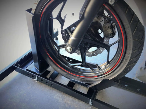 Side view of a motorcycle front tire in Heavy Duty Beefy Motorcycle Wheel Chock For Trailers And Garages By MaxxHaul, 1800 Pound Capacity