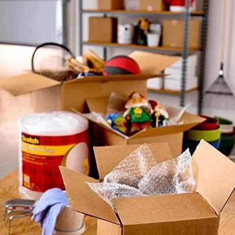 Boxes packed for moving with Scotch Sure Start Packing Tape Clear 1.88 In X 22.2 Yd 6 Dispenser Rolls Quiet Unwind Easy Start Strong Hold