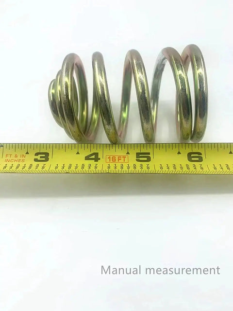 Two Pack Replacement Mower Compression Seat Springs 283516 For John Deere with tape measure for size reference.