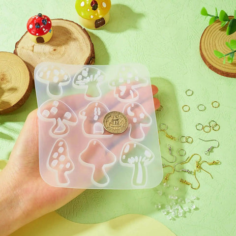 Hand holding mushroom mold from Mushroom Earring Mold Kit For Resin Jewelry Making With Silicone Mold Includes 40 Hooks 60 Jump Rings 50 Ear Nuts For Dangle Earrings Diy Jewelry Supplies Cheriswelry