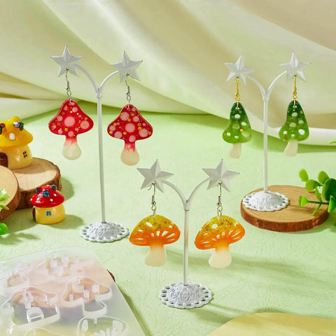 Colorful mushroom earrings on display with the Mushroom Earring Mold Kit For Resin Jewelry Making With Silicone Mold Includes 40 Hooks 60 Jump Rings 50 Ear Nuts For Dangle Earrings Diy Jewelry Supplies Cheriswelry in background