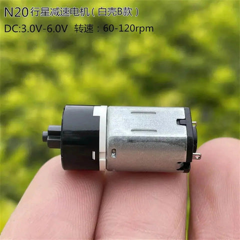 DC 3V 5V 6V Mini N20 Planetary Gearbox Gear Reducer Motor Cross Shaft(Model B 60-120RPM) in hand, showing side view.