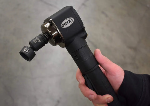 Hand holding Pinless Nano Universal Impact Socket Set For Three Eighths Inch Drive Pro Grade Workhorse Ten Piece Set With Sizes Ten Through Eighteen Millimeter 360 Degree Rotating Head Ultra Short Profile Forged Cro Mo Lifetime Warranty Astro Pneumatic Tool.