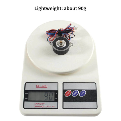 Nema 14 36mm Pancake Stepper Motor with 8 Tooth Gear placed on scale showing weight of 90g for precise measurement.