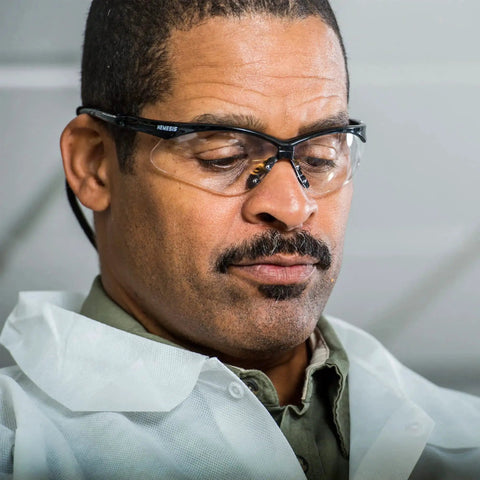 Man wearing Nemesis Safety Glasses With Black Frame Clear Lenses Anti Fog 12 Pack in a work environment