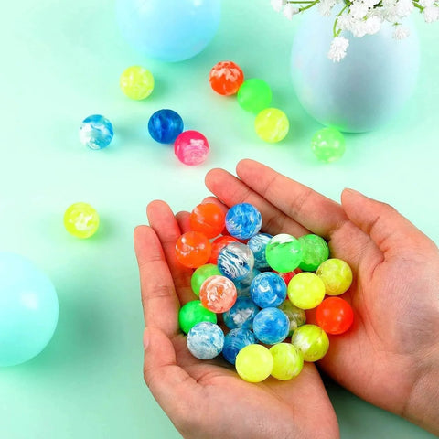 Hands holding assorted neon Small Bouncy Balls in Bulk Rubber High Bouncing Balls for Baby Toddler Birthday Party Favors Gift Game Prizes