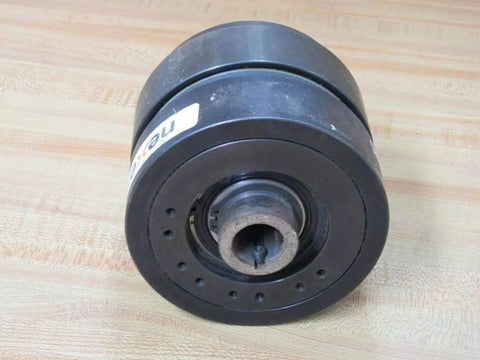Nexen Group 801502 Air TL-A Torque Limiter with 0.875in bore on a wooden surface, showcasing set-screw mount and open design.