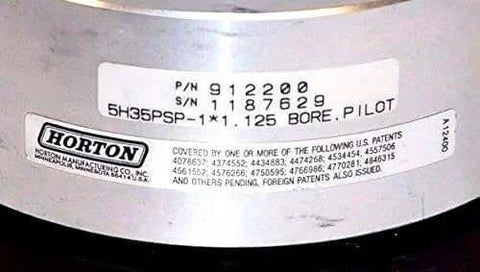 Close-up of label on Nexen Horton 912200 Tooth Clutch 5H35Psp-1 1.125 Bore showing part number and serial number.