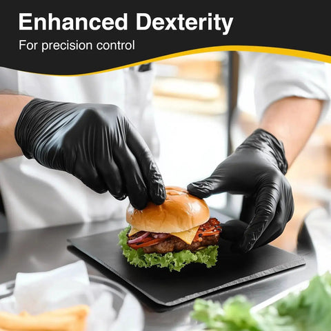 Chef wearing black nitrile exam gloves latex free powder free disposable for medical and food prep, handling a burger.