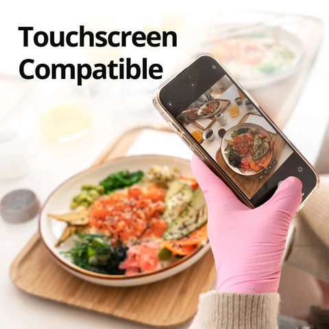 Person wearing Nitrile Exam Gloves 4 Mil Medium Cherry Blossom Powder Free Latex Free Food Safe, using phone over food.