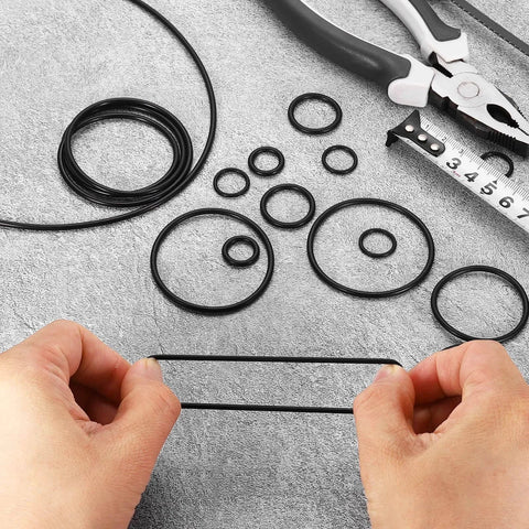 50 Pcs Nitrile Rubber O Rings NBR 1 Inch Internal Diameter 1-1/8 Inch Outer Diameter 1/16 Inch Width 70 Durometer Black Sealing Gaskets displayed on gray surface with tools