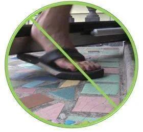 Foot using the Heavy Duty Door Closer System (White) in hands-free mode with hold-open feature, close-up view.