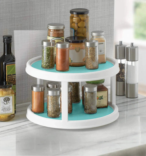 Non-Skid 2-Tier Turntable 12-Inch Lazy Susan Organizer with spices on marble countertop.