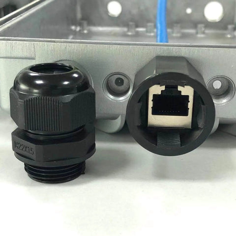Black connector and port on a metal panel, part of Waterproof Nylon Cable Gland Kit With 50 Pieces, 3-16 mm Range, Includes PG7 PG9 PG11 PG13.5 PG16 PG19, IP68 Plastic Glands For Indoor And Outdoor Use