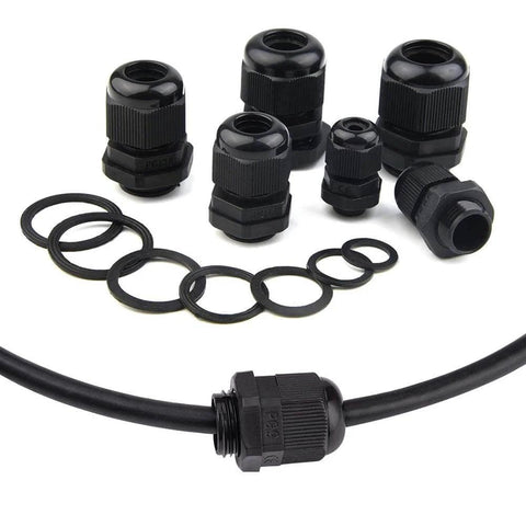 32 Pieces Nylon Cable Gland Kit Waterproof IP68 Adjustable 3 To 18mm With NPT 3/4 NPT 1/2 And PG13.5 PG11 PG9 PG7 Threaded Glands For All Weather Ready Enclosures And Electrical Boxes Black, including various sizes and rubber seals.