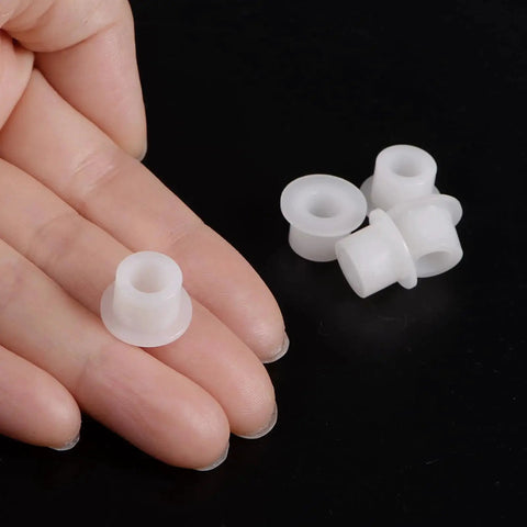 Close-up of a 12 Pack Nylon Flanged Sleeve Bearings 6.1mm Bore By 9.9mm OD By 8.3mm Length White Self-Lubricating Bushings for low-friction use.