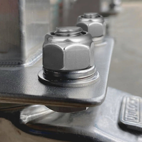 Close-up view of M10 1.5 Nylon Insert Lock Nuts Pack Of 20 Self Locking Nylock Nuts Hex Coarse Thread DIN 985 304 Stainless Steel Black Zinc Plated A2 70 For Durable High Strength Fastening In Machinery Automotive And Diy Projects installed on metal surface