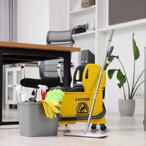 Office with mop bucket and cleaning supplies next to desk featuring Four Piece Mop Bucket Wheel Replacement Set Non Marking TPR Casters.