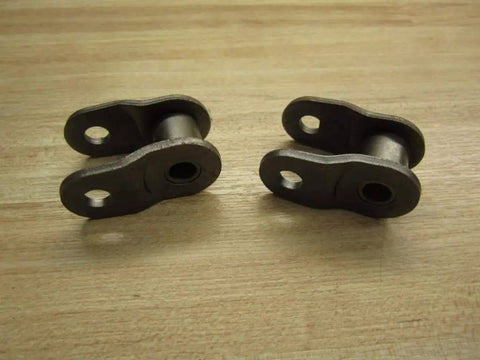 Five Brand New Rexnord REX80-2 Offset Chain Links Lot Of Five Premium Grade Built To Handle Real Tough Jobs In Harsh Industrial Environments Perfect Replacement For Conveyor And Mechanical Drive Chains Easy Install, two chain links on wooden surface.